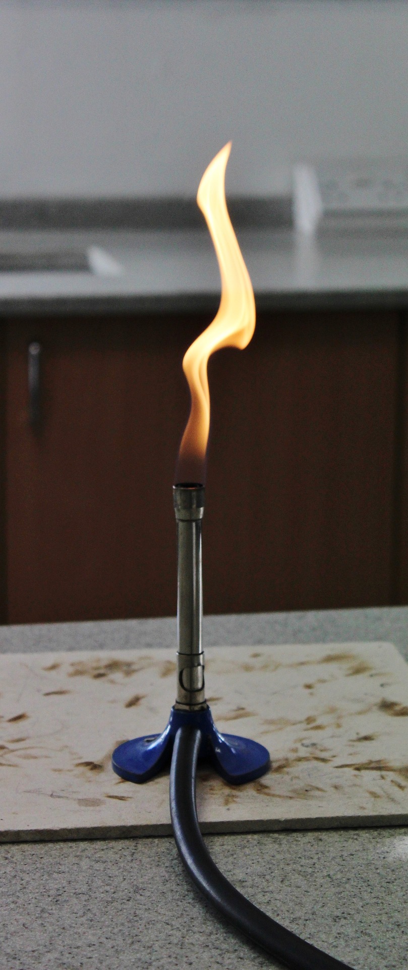 a photograph of a lit Bunsen burner (safety flame)